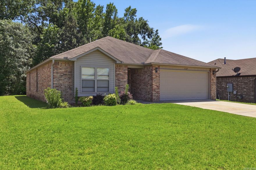 Beautiful and well-maintained 3-bedroom, 2-bath home in a convenient Alexander location! This 1,422 SF home features durable luxury vinyl plank flooring throughout the living area and kitchen, with comfortable carpet in the bedrooms. The functional layout offers a spacious living area, great natural light, and an inviting kitchen perfect for everyday living with a breakfast bar. Enjoy relaxing or entertaining on the back patio overlooking the backyard. Conveniently located near shopping, dining, schools, and easy interstate access. A great opportunity to own a move-in ready home in a desirable area!