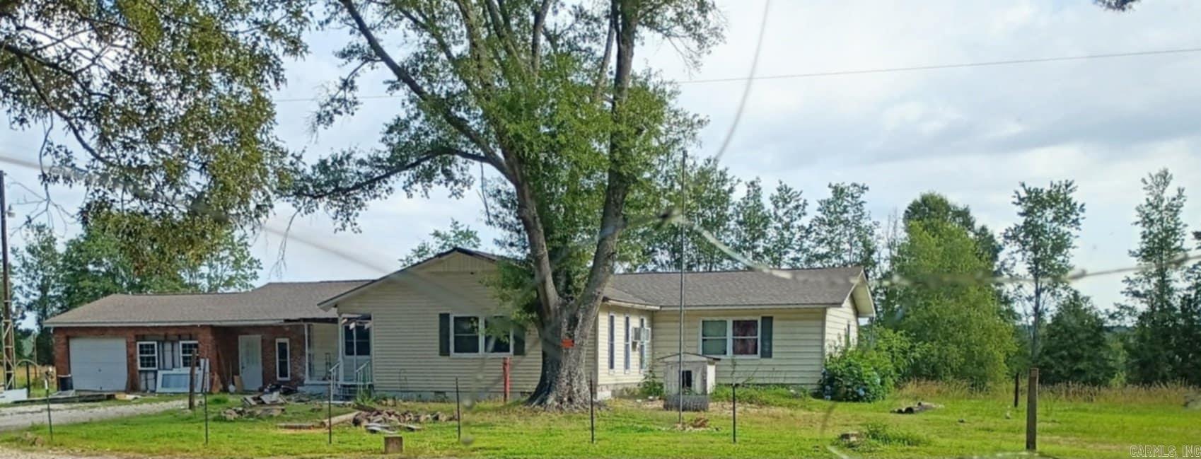 Country home with acreage near Lake DeGray, needs some repairs.