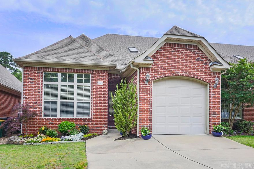 Charming one-level townhome that offers comfortable and convenient living. This beautifully designed townhouse features 2 bedrooms, 2 full baths, and a one-car garage. Built in 2008, it combines modern elements with elegant touches. Step inside and be greeted by arched openings that add architectural interest throughout the home. The kitchen is a true delight, featuring a new dishwasher and gas range, an island with seating, and ample storage. Adjacent to the kitchen, a separate laundry room offers convenience and functionality. The flagstone patio added in 2021 creates a serene outdoor space for relaxation and entertainment. Inside, a gas log fireplace adds warmth and coziness to the living area. The property also has newly installed French drains, ensuring proper drainage. The back doors leading to the patio were recently repainted and sealed in 2021. The monthly POA fee of $100 covers landscaping in all common areas. With an abundance of natural light, the home feel feels light and airy throughout.  See AGENT REMARKS.