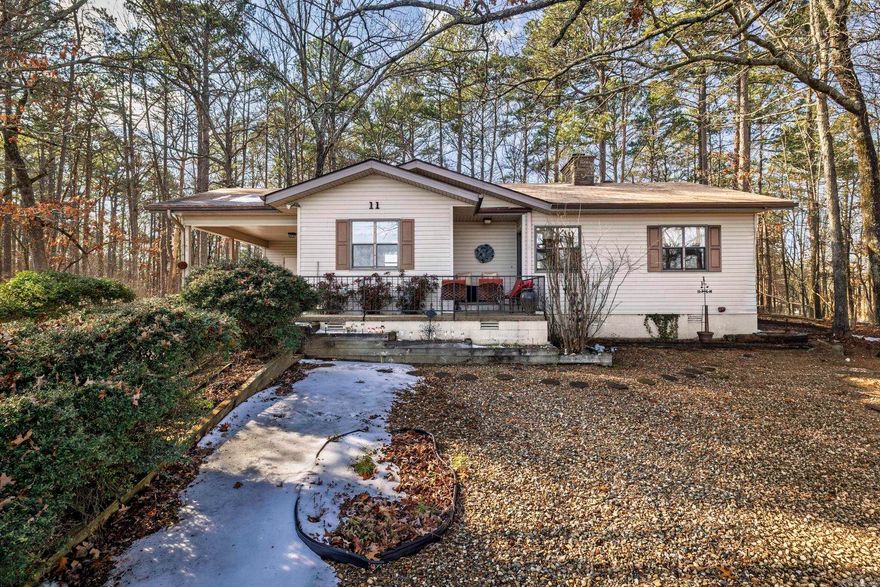 Enjoy nature from the deck of this well-maintained home, centrally located in beautiful Hot Springs Village, Arkansas. The fenced backyard provides a perfect playground for your fur babies or grand babies. The two storage buildings offer workbenches for your hobbies and projects, as well as plenty of storage. Furniture and appliances are negotiable.  Roof replaced in 2019. Hot Springs Village has a one-time buy-in fee of $2,000 paid at Closing.