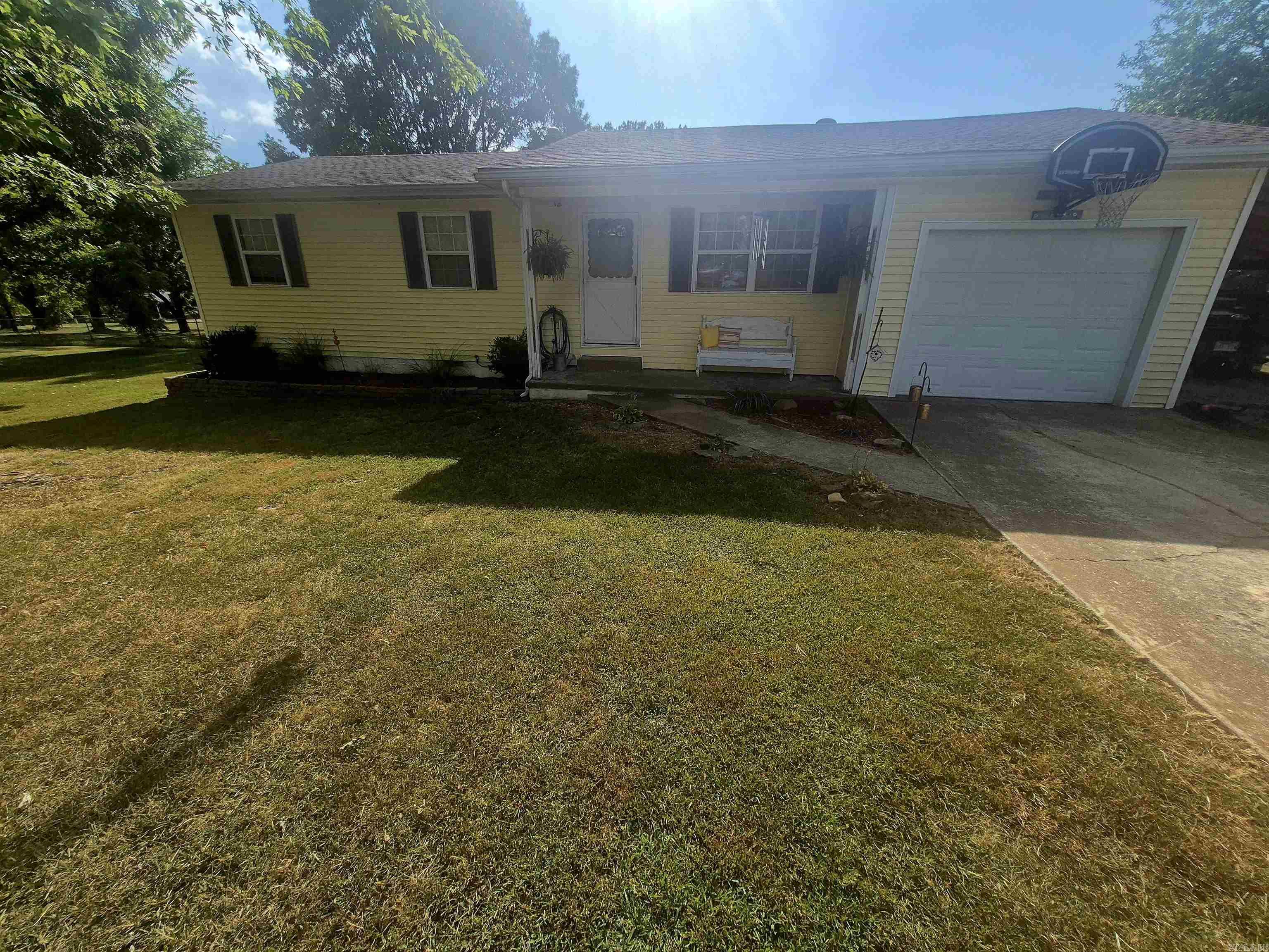 Located at 5749 Keystone Lane in Harrison AR, this charming home offers approximately 1,200 square feet of comfortable living space on a little over half an acre. It features 3 bedrooms and 1.5 bathrooms, with attractive laminate flooring throughout. Surrounded by mature shade trees, the property includes an above-ground swimming pool, perfect for enjoying warm summer days. The roof was replaced about 5 years ago, adding to the home's overall value and appeal.