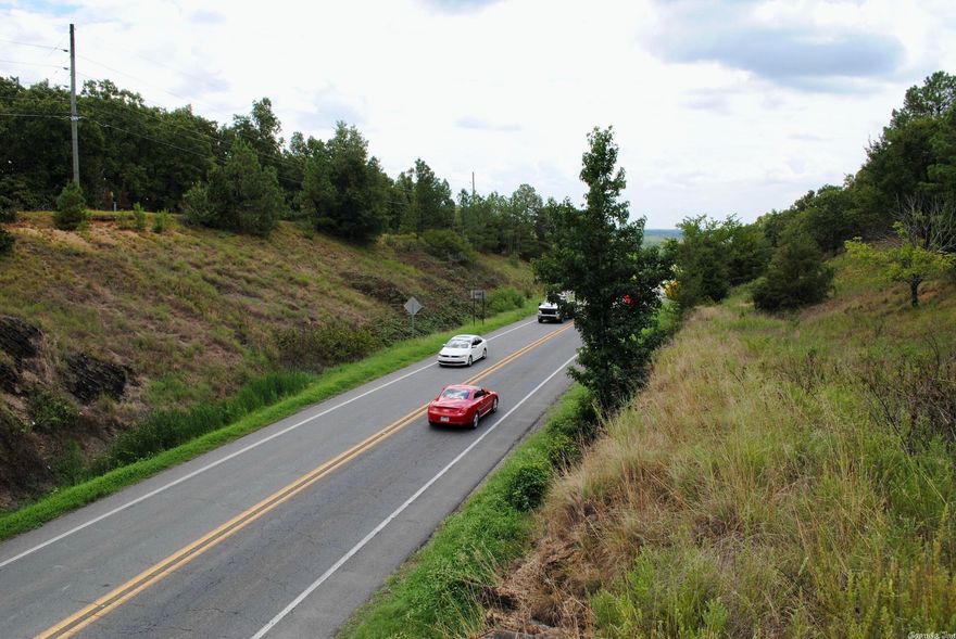 Located on Highway 5, just minutes from Cabot, this property has about 1000 feet of Highway frontage. The gently sloping terrain has a nice ridge with several building sites. Mature timber with some rock formations and abundant wildlife adds to a park-like setting. An access point on the Highway may need to be improved to accommodate larger vehicles, and some utilities are available at the Highway. Call Mike Poor or Jeff Hodges for more information.