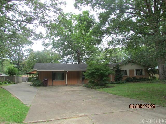 Beautiful view of Lucus Pond and the City Park, this lovely home is located across from the Boat Ramp for Lucus Pond. This spacious home with lots of landscaping features a formal living room, dining room open to the kitchen and large family room, kitchen with breakfast bar, gas stove, microwave, lots of cabinets, large family room with French Doors leading to a Cypress deck, built-ins, 4 bedrooms, two full baths and one half bath. There are storage closets everywhere. The laundry room is large also. The driveway circles to the backyard and has a double carport with the house, patio, RV Shed, a wonderful 20X14 shop with 40 amp plug, another deck with storage shed attached. Have to see this one to know all the amenities. The Roof is 4 yrs old, high efficiency central unit, less than 12 yrs old, hot water 6 yrs old, floors are tile, vinyl Seller has had work by Olshan on the foundation with a transferable lifetime warranty. This home would be great for a big family.
