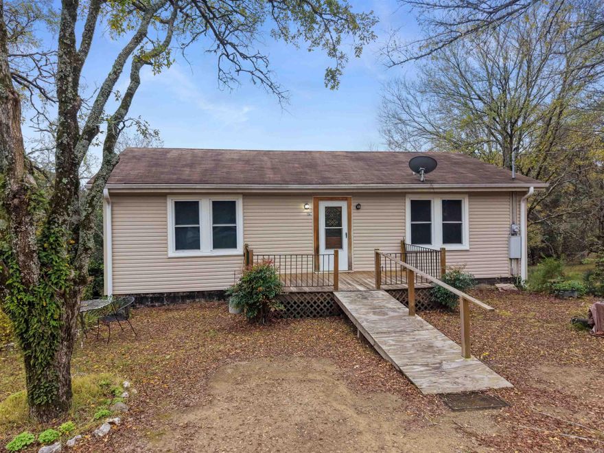 Set on 4.32 picturesque acres, this 1972 family home offers flexible two-level living with room to spread out. The main (upper) level features 2 bedrooms, 1 bath, a light-filled living room, an eat-in kitchen, laundry hookup, and a walk-out deck overlooking the peaceful countryside. The lower level includes a second living area, 1 bedroom, 1 bath, a laundry room, a second kitchen, and a dining room, ideal for multigenerational living or guest quarters. Two outbuildings provide space for storage, tools, or hobbies. The home currently has no central heat or air but is equipped with propane heaters upstairs and downstairs (just add a propane tank). With open land for gardening, animals, or expansion, this well-loved family property is full of potential and rural charm.  Home is on city water but there is a well on the property.