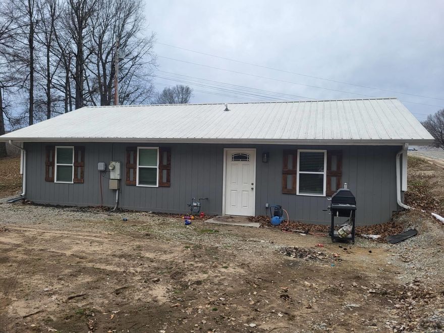 3BR 2B, City Limits w/ Country SettingThis 3 bedroom, 2 bath home was completely remodeled in 2023/2024. It has new appliances, LVT flooring, new siding,sheetrock, windows, and gutters! Some of the electric and plumbing have been replaced. There has been a rubberized sealant puton the metal roof that has a 15 year warranty. The waterline from the main to the home is new and the yard has been planed!This family is growing and they need a bigger home!! Their loss is your gain! This home will qualify for a government loan.