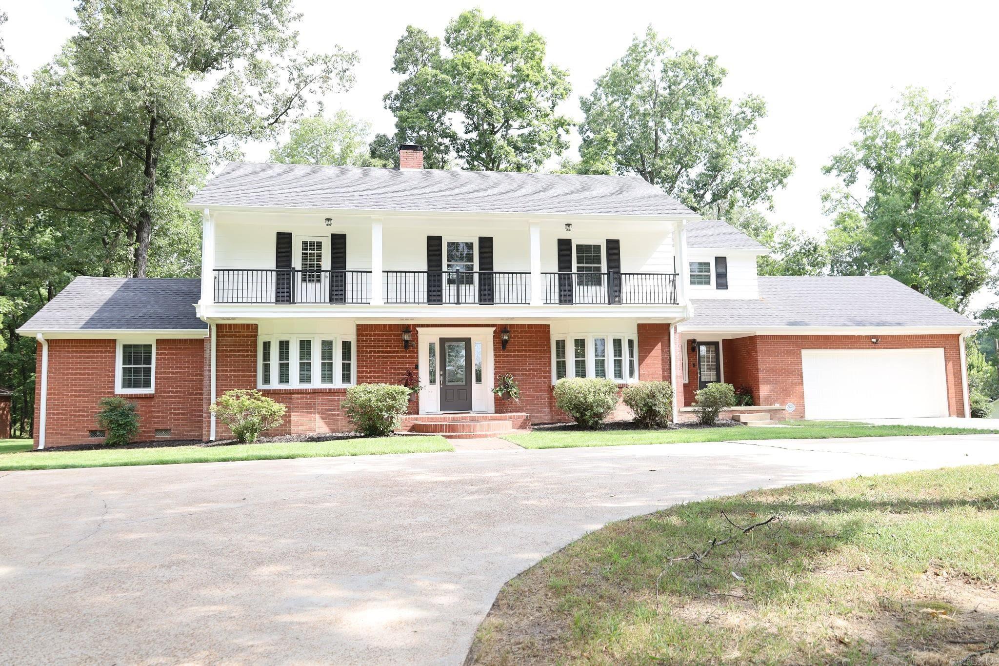 Welcome to 1701 Barnhill--a stunning blend of timeless character and modern updates, all nestled on 2.00 acres m/l inside city limits in one of the area's most desirable locations. This beautifully maintained home offers 5 spacious bedrooms, 5 full bathrooms, and a dedicated office, with one bedroom conveniently located on main floor. With 3,040 sq ft of living space plus an additional 1,401 sq ft of finished basement, there's room for everyone and everything. Step inside to find a completely remodeled kitchen and main floor bath, featuring quartz countertops, stainless steel LG high-end appliances, and fresh flooring and paint throughout. All new exterior doors and windows, along with a new roof and two HVAC units (installed just 3 years ago), offer peace of mind for years to come. The water heater is just 2 years old, and the home is equipped with two newer sump pumps in basement, inspected annually for added protection. Other recent upgrades include blown-in attic insulation, new gutters and a leaf filter system. The newly upgraded balcony with updated railings offers a peaceful place to enjoy the outdoors. This home has it all-modern functionality and vintage charm in one!