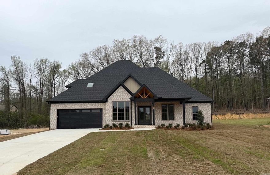 Beautiful new construction home on in gated community. High vaulted ceiling, open floorplan, Iberian Hazelwood hardwood floors run throughout the downstairs. The fourth bedroom is upstairs and could also be a bonus room. Kitchen has Ruvati kitchen sink, GE Profile dishwasher and gas stove top with convection oven. Delta Premium faucets throughout the home, porcelain tile, frameless shower enclosure in primary bath, and Sherwin Williams premium paint. The home offers a high efficiency heat pump, Marathon electric Hot water heater, Heatilator sealed gas fireplace, and much more! Landscaping and sprinkler system will be started soon. Enjoy the maintenance free exterior and wonderful amenities the community has to offer with clubhouse, pool, tennis court, and walk trails around the lake and throughout the area.