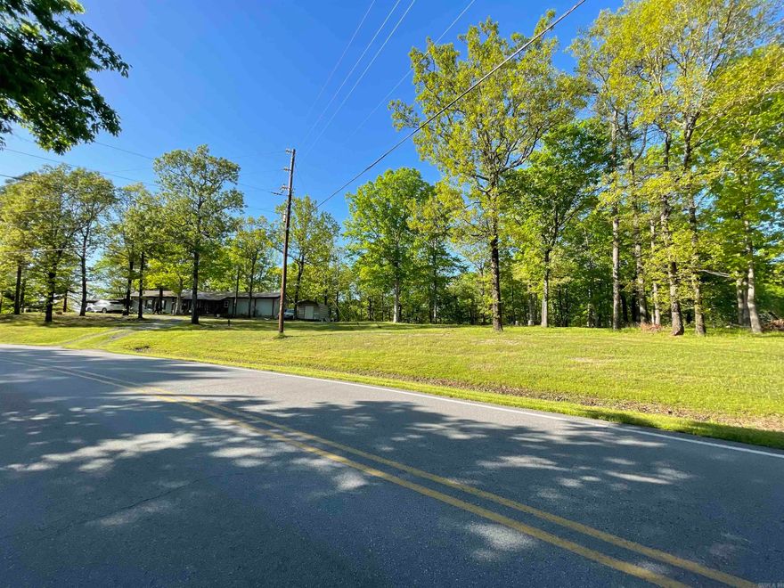5.03 acres.  Just minutes to Lake Norrell. Wooded peaceful acreage with alot of deer.  Flat along road front for building or mobiles.    2 out buildings connected with breezeway will stay.  Only 15 minutes to Benton.  Convenient location for recreation and country living.