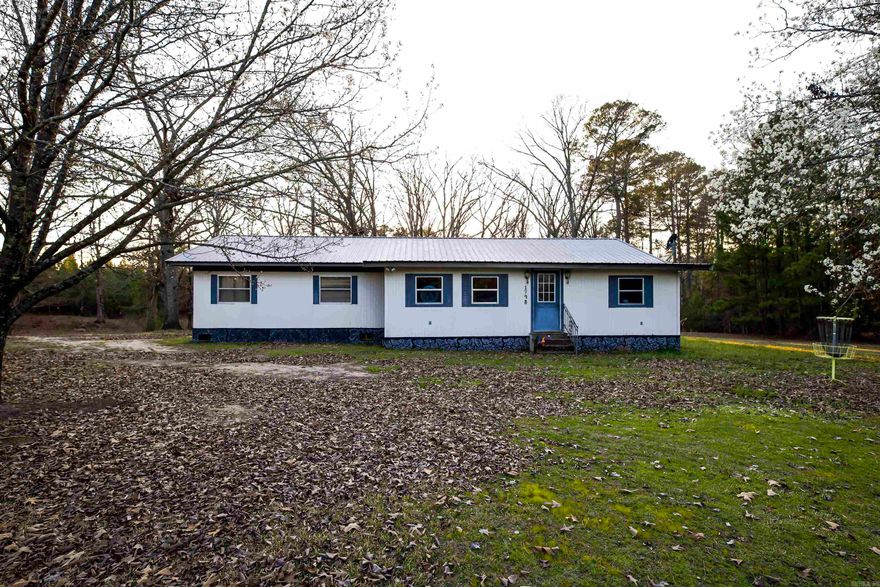 Enjoy peaceful country living in this charming rural mobile home featuring several updates and inviting spaces both inside and out. The home offers beautifully updated kitchen cabinetry and appliances, creating a refreshing and functional space for cooking and gathering. A whole-home generator provides peace of mind. A bright and relaxing sunroom provides the perfect spot to enjoy your morning coffee, unwind with a good book, or create a playroom or home office. Step outside to enjoy a wood deck ideal for grilling, entertaining, or simply relaxing outdoors. The property also includes a detached shop, offering excellent space for hobbies, storage, or a workshop. With its blend of rural tranquility, practical upgrades, and extra workspace, this property is a great opportunity for anyone looking to enjoy comfortable country living.