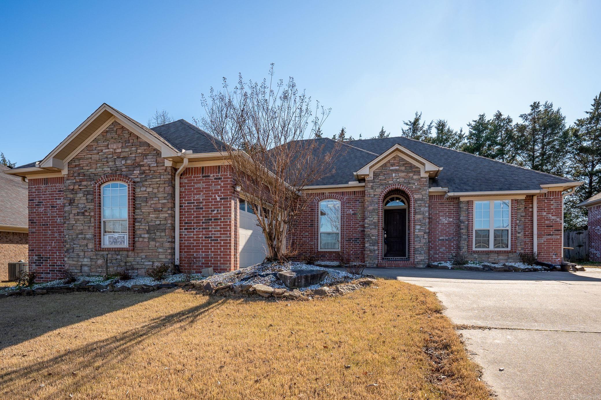 Check out this stunning brick home in west Conway! It features a stylish side load garage and a spacious driveway. Inside, you'll find luxury vinyl floors, a separate dining room, spacious laundry and a pantry for all your storage needs. The split floor plan offers privacy, while the primary suite and bath boasts a jet tub and a roomy closet. Enjoy the outdoors on the covered back patio and extensive landscaping in the front that adds to the home's charm. This place is a perfect blend of comfort and elegance, call to see it today!