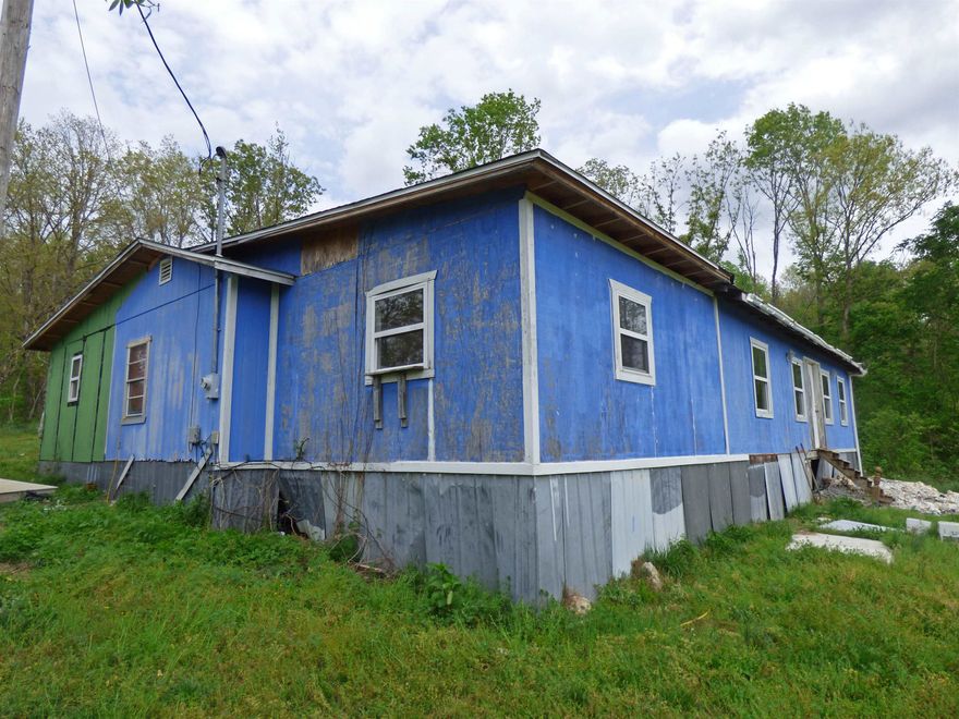 Fixer Upper on One Acre of Land. This house has 1,890 square feet of living space with 3 bedrooms, 1 bathroom, and living room. It's partially finished but still requires a lot of work. Situated on an acre of Martin Creek Road and being a nice sized house this would be a great investment project OR the way to get exactly what you want in a home.