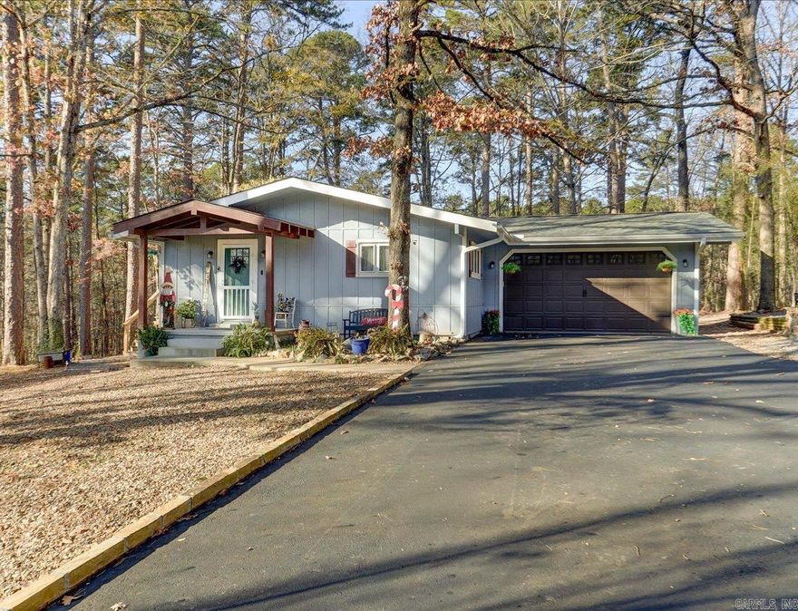 Hurry!! Check out this wonderfully updated home in Hot Springs Village, Arkansas... what a cozy, comfortable home for a family or empty-nesters with room for company to visit.  Kitchen upgrade/remodel completed in 2024 by Re-structure.  This is a truly updated home with an open living/dining/kitchen.  All new kitchen appliance package.  Updates include: leaf guard gutters, new flooring in main area, new roof in 2024, new Garage door in 2021, new covered porch in 2020 along with newly painted exterior.  Hot Springs Village has many amenities to offer....Largest gated community in U.S.  Over 26,000 acres.  11 lakes and 9 golf courses.  Fitness Center with indoor pool, large spa whirlpool, sauna, fitness classes.  3 of the lakes have marinas.  Come to HSV and experience an active lifestyle in the heart of Arkansas.