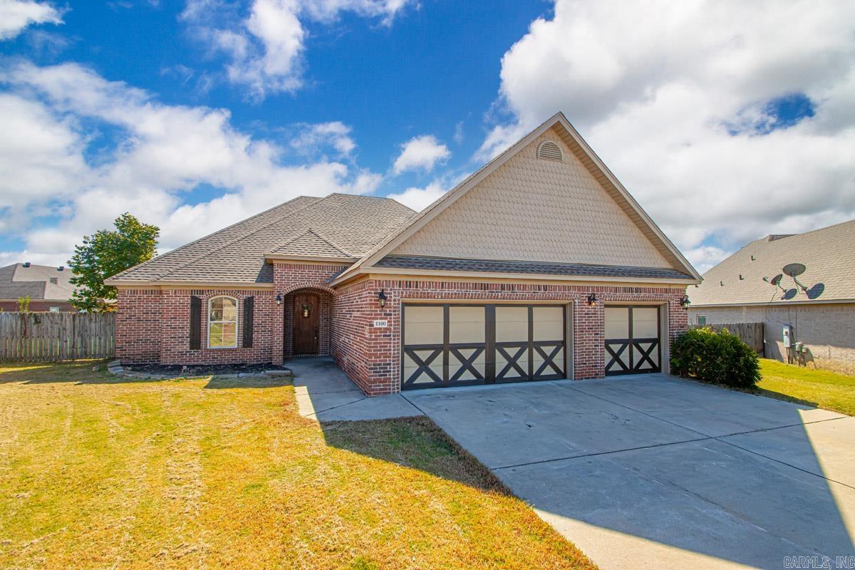 Step into this charming and beautifully maintained 4 bedroom, 2 bath family home nestled in the desirable Hurricane Meadows subdivision of Benton, AR. With a welcoming brick-accented exterior, a three-car garage, and a manicured yard, the home exudes curb appeal from the moment you arrive. Inside, an open and flowing layout invites you into a bright living area that connects seamlessly with the dining space and kitchen, perfect for everyday living and entertaining. Thoughtful finishes, ample storage, and generous natural light throughout add to the warm and inviting feel. Located in a stable, sought-after neighborhood close to schools, amenities, and community services, this home combines comfort, style, and convenience for family living.