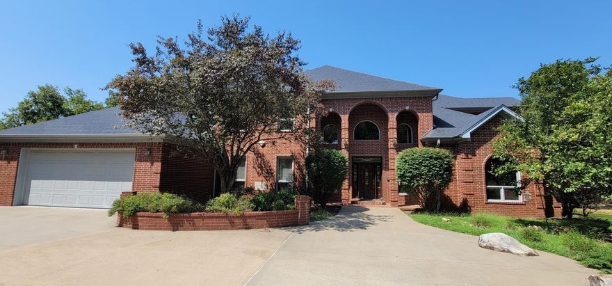 Gorgeous custom-built home on 11.8 acres with a breathtaking view of Lake Maumelle. Only minutes away from Pinnacle Mtn & Chenal. This well designed & spacious home has many features, some of which are a safe room, propane powered backup generator, pellet stove, central vacuum system, separate ice maker, and a stunning Schonbek chandelier. The basement features a safe room, a wood stove, a cypress planked trophy wall, and a spacious room that can be turned into a 5th bedroom, and a full bathroom with central heat and air.  There is a propane back-up generator in case electricity goes out.  There is also a 26' by 36' insulated shop separate from the house that is great for any hobbies that you may have. This house has many more features to see. See Agent Remarks.