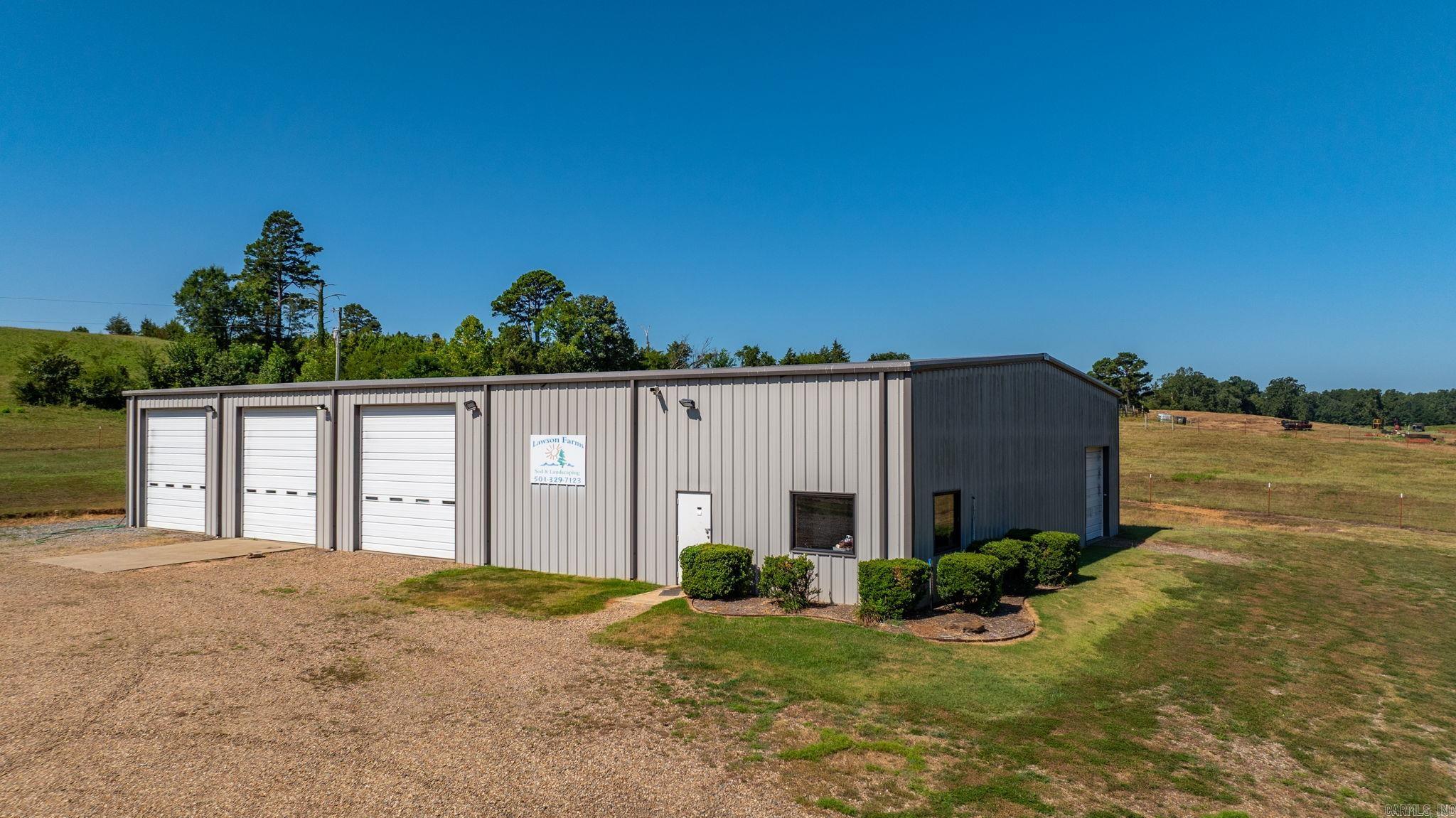 Exceptional Commercial Opportunity on 6.22± Acres in Houston, AR! This 6,000 sq ft fully heated and cooled metal building is steel-framed, heavily insulated, and features 6" thick concrete floorsāideal for heavy-duty use. The structure measures 60' x 100' and includes three oversized garage bays perfect for RVs, plus a separate single-car garage bay on the side. Inside, you'll find a private office, restroom, and kitchenette with a sitting area, along with lofted storage above the office. This versatile space is perfect for RV or boat storage, classic car collectors, race car maintenance, or light industrial use. With over 6 acres of land, there's plenty of room for expansion or additional development. Conveniently located off Hwy 216 with easy access to nearby cities. Endless potential for business or hobby use! Also listed as Commercial Use. Please see MLS #: 25031075