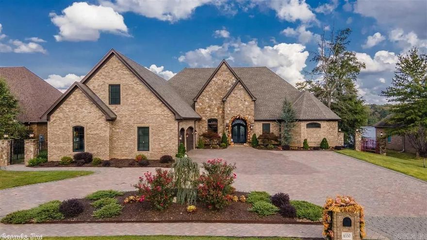 This home is in gated Westshore at Hurricane Lake Estates , the home sits on a large lake lot on the main body of water. main level has two living area with formal dining and office. Kitchen has commercial appliances, stained cabinets with large island. Primary bedroom over looks the lake, Primary bath has walk through shower with free standing tub. Upstairs has its own side entrance, with full kitchen and washer and dryer. Three bedrooms with bonus room and full bath and shower. Large deck overlooks lake.  See agent remarks.