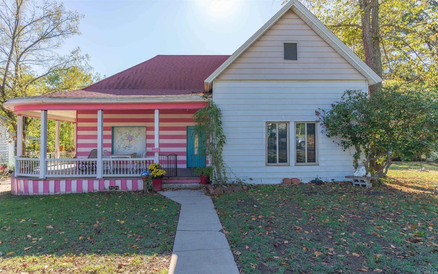 Historical home with large kitchen, formal dining, spacious living room, large baths & laundry area. Hardwood floors throughout & tile in the baths. The front deck is a perfect place for morning coffee or afternoon tea. Enjoy many different fruit trees from apple to peach to a cocktail tree. Herb gardens, luscious grape vines, flowering bushes and the fertile garden area are a green thumb delight. Fenced back yard for your fur friends. New 27x25 detached metal building with auto garage door 24 HOUR NOTICE REQUIRED FOR SHOWING!