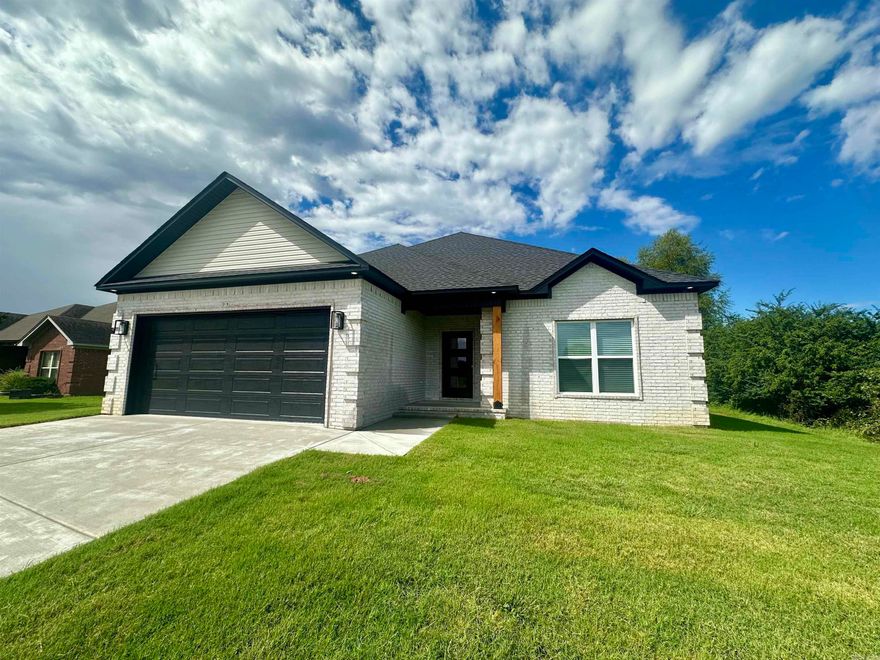 Welcome to this brand-new, all-brick home, where modern elegance meets comfort. This beautiful 3-bedroom, 2-bathroom residence features a thoughtful, open-concept design that’s ideal for everyday living and entertaining. The spacious bedrooms all include large closets, providing ample storage. The primary suite offers a true retreat with a luxurious, spa-like bathroom that includes a large soaking tub and a custom-tiled walk-in shower. Natural light fills the home, highlighting the modern colors and high-end finishes, from the accent walls to the expansive quartz kitchen island, which is sure to become a central gathering spot. The kitchen is designed for functionality and style, complete with a large pantry featuring automatic lighting. Durable luxury vinyl plank flooring flows through the common areas, adding both beauty and practicality. This home is a perfect blend of stylish design and comfortable living. Schedule a tour to experience it for yourself.