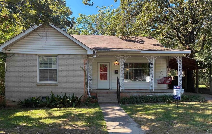 Hillcrest Charm in this 3 bedroom, 2 bath furnished brick one-level with covered parking. Large front porch with red porch swing, from which to hear the neighborhood church bells ring. Hardwoods, Saltillo tile in kitchen & in one of 2 baths. Regular-size Washer/dryer in hall closet with shelves. Fridge, Dishwasher, Microwave, gas stove & Nespresso machine. Separate dining room. 2 storage sheds, one large enough for workshop or art studio or craft or game room, the other with additional fridge. 2 patios, one flagstone, one concrete. Outdoor table & chairs, outside fireplace/firepit, charcoal grill, smoker & some privacy fencing.  Outdoor art mural. Lots of windows, ceiling fans in all bedrooms. One bath with tub/shower combo, the other with adjoining bedroom has a stand-up shower. Walk to grocery, post office, cafes, boutiques & church.