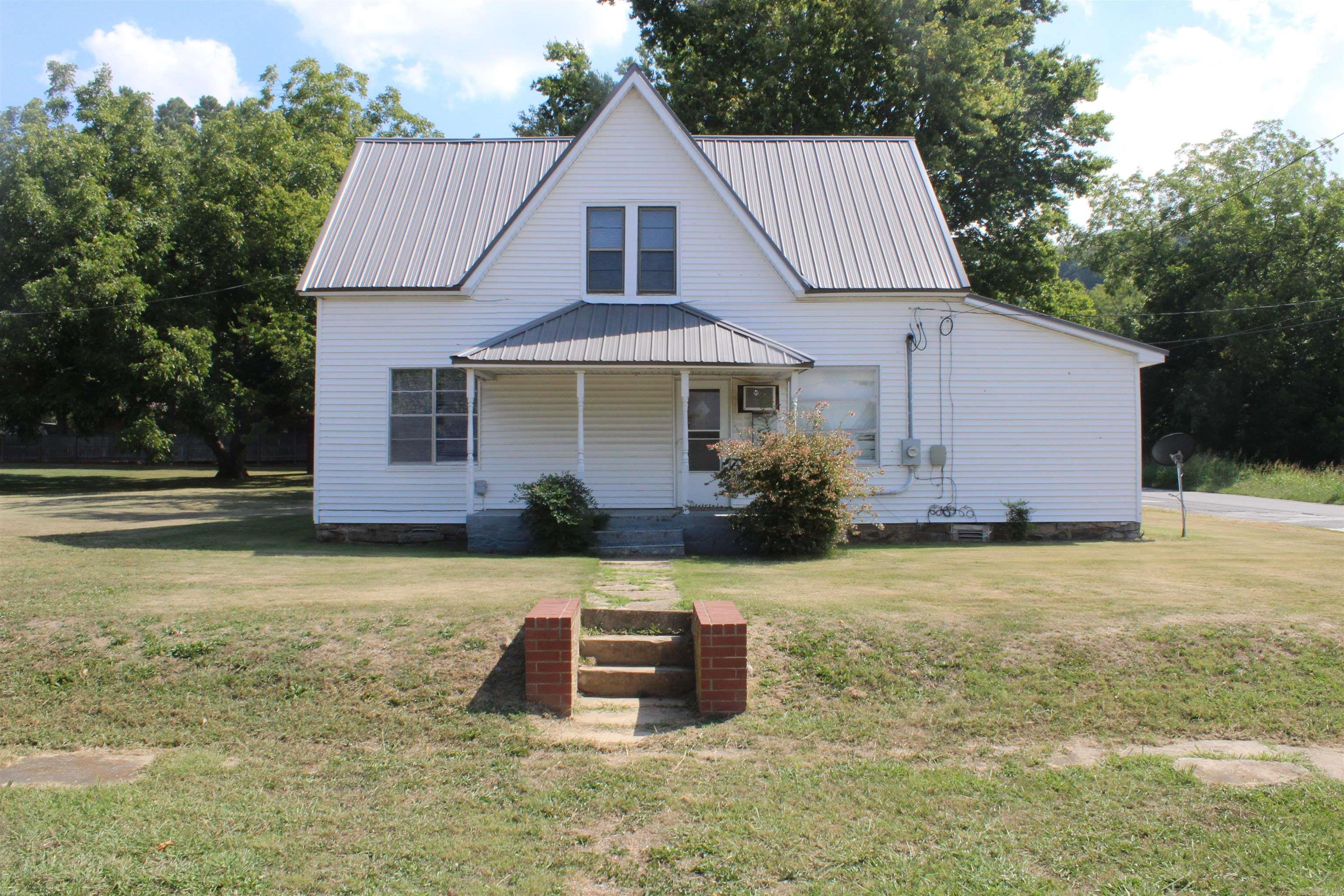 Fixer-Upper with Investment Potential in the Heart of Marshall, AR Opportunity knocks with this 1,604 sq ft fixer-upper located within the city limits of Marshall, Arkansas, sitting on a 0.20 +/- acre corner lot. Whether you're an investor, renovator, or looking for your next home project, this property offers a prime location just waiting to be revitalized. With its central location, this property holds great potential as a monthly rental, an Airbnb, or a full-time residence. You're just minutes from all the local amenities and everyday essentials, making it a convenient and desirable place to live or host guests. Only 15 minutes from the Buffalo National River, outdoor enthusiasts will love the quick access to kayaking, canoeing, fishing, hiking, and a host of other recreational activities in one of Arkansas’s most scenic regions. Marshall is also home to a unique gem — the Kenda Drive-In, one of the few remaining drive-in movie theaters in the country. For even more excitement, Branson, MO is just an hour and a half away, offering world-class entertainment, shopping, and dining. bring new life to a well-located home. Property sold as is!