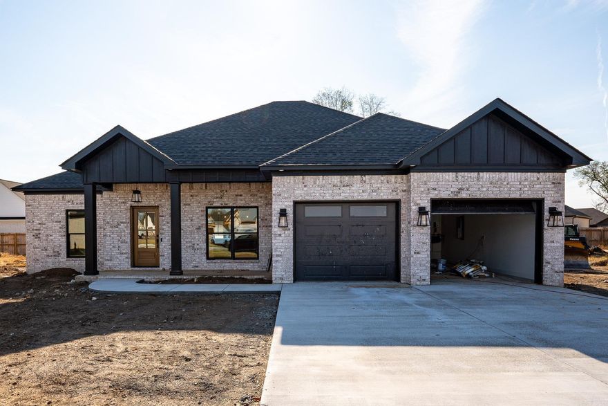 Discover the perfect blend of modern luxury and comfort in this stunning new construction home by Kyle Berryman, located in one of Greenbrier's newest subdivisions. The interior boasts beautiful wood look tile floors in the main areas and quartz countertops.  The home displays neutral tones, creating a serene atmosphere throughout. The spacious primary bath is a true retreat, offering both a walk-in shower and a relaxing soaker tub.  Upgraded features include tankless water heater and soft close cabinets and drawers.  You will want to make this house your home!
