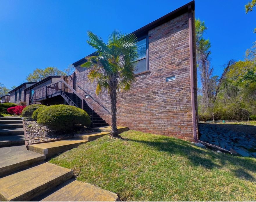 Discover your ideal retreat in the heart of Hot Springs! This exquisite two-bedroom, two-bath, single-level townhome, a coveted end-unit, blends modern elegance with peaceful surroundings. Tucked away in a tranquil neighborhood surrounded by lush green spaces, this home offers both serenity and unmatched convenience to all the town’s amenities.  Step inside to a bright, light-filled great room with vaulted ceiling and gorgeous, newly installed laminate plank flooring that flows throughout the home. The kitchen is equipped with brand-new appliances and refrigerator stays. The large master suite serves as a quiet haven with ample space and comfort, and a private patio walkout—perfect for unwinding in peace.  Step outside the great room to your spacious deck that overlooks green space lush with foliage and songbirds. It’s an idyllic setting for sipping morning coffee or hosting barbecues. Covered parking is just outside your door, while the prime location puts you minutes from Hot Springs’ best—hospitals, medical offices, shopping, golf courses, dining, downtown, and three breathtaking nearby lakes.  The community has exceptional amenities: a sparkling pool, and a relaxing hot tub.