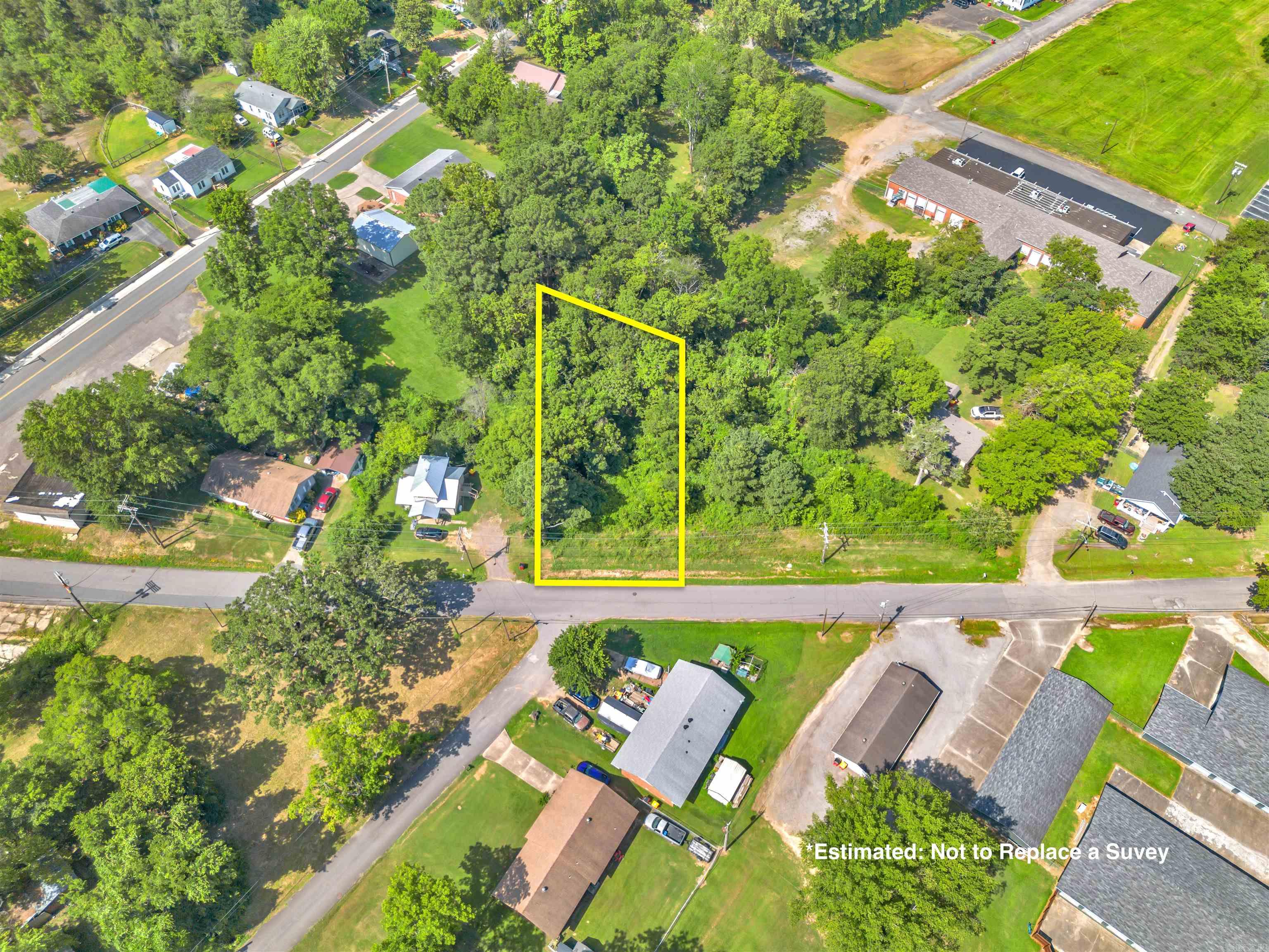 Discover the perfect setting for your future home on this beautiful .40-acre lot located within city limits. Nestled in an established area, this parcel offers the best of both worlds- natural privacy with convenient access to city amenities. Just minutes from a local school, city park, and community pool, it's an ideal location for anyone looking to build in an accessible neighborhood. With mature trees providing shade and character, this lot is ready for your vision to take shape!