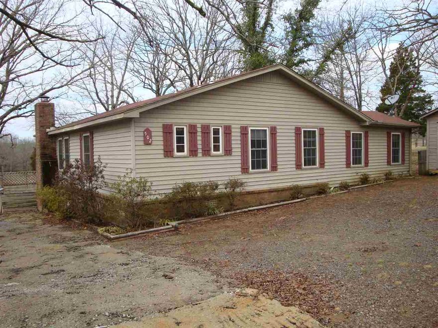 This property has been updated in several ways.  Baths are very modern, kitchen has oak cabinetry, covered porch and deck overlooks pastureland.  Replacement windows.  Some hardwood floors, fireplace.  Detached 20'x20' shop with overhead doors plus walk-through door and shed. Mineral rights were reserved by a previous owner. Old storage building also on property. Offers are made at homepath.com. A complete offer will include docs found on-line.