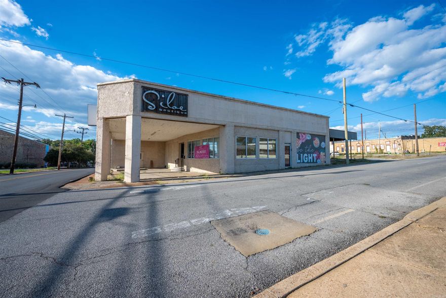 Endless potential in the heart of BATESVILLE'S HISTORIC DISTRICT just steps from MAIN STREET! This est. 9,718 SQ FT commercial building is positioned with prime visibility with a 9,100 DAILY TRAFFIC COUNT per ARDOT. The STOREFRONT is move-in ready with NEWER SPRAY FOAM INSULATION, 5 DRESSING ROOMS, a HALF BATH, OFFICE with an additional HALF BATH, and plumbing for a KITCHEN space. Already conditioned for RESTAURANT USE with a GREASE TRAP, this property can potentially be transformed into RETAIL, DINING, OFFICE, or MULTI-BUSINESS space. Additional areas include OFFICE, another RETAIL SPACE with MEN'S AND WOMEN'S BATHROOMS, and STUDIO space. With THREE COMMERCIAL-SIZED ELECTRICAL PANELS, one full and two open for expansion. It is a BLANK CANVAS, ready for your business plans with Convenience of an ON-SITE PARKING LOT.
