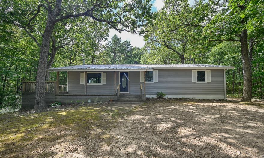 Nestled among the trees atop a gently sloped hill, this inviting home offers peace, privacy & beautiful natural surroundings. Step inside to beautiful vaulted ceilings, new carpet & enjoy the wood stove, a great secondary heat source for cooler days. French doors off the main living room lead out to the spacious deck, perfect for morning coffee or evening relaxation. The home features multiple large closets & an oversized laundry room for plenty of storage. A second living room with French doors open to a private patio out back, while a dedicated office space off the kitchen provides a quiet spot to work or study. Some new Argon windows, one being a large picture window in the front living room that brings in natural light & offers wonderful views of the birds & squirrels at play. Outside, you’ll find a storage building, plus a 50-amp RV hookup with separate water, sewer, and its own driveway off Highway 270, ideal for guests or full-time RV use. Located at the base of Rich Mountain, just 3 miles from Queen Wilhelmina State Park, and with National Forest access directly across Highway 270 on Polk 59, this property is a nature lover’s dream! Agents see remarks.