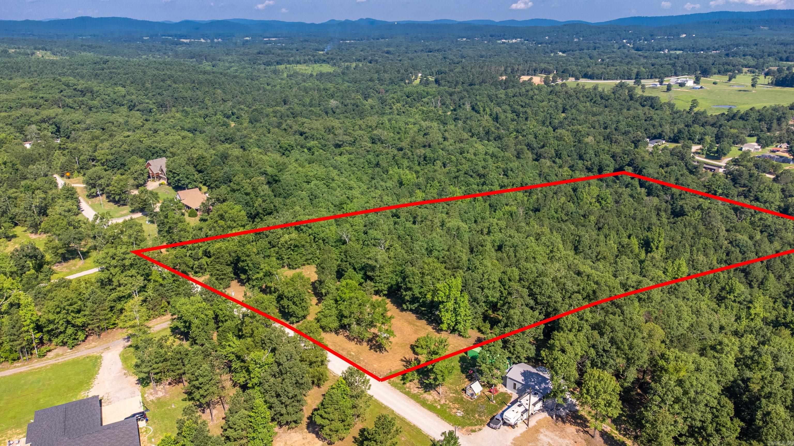 Discover 11± acres of opportunity on Forestridge Road—perfectly positioned for your dream home. This beautiful property offers a prime buildable site with scenic views overlooking Cearley Creek, which meanders along the bottom edge of the land. Enjoy the sights and sounds of nature with plenty of wildlife roaming the area. Tucked away yet conveniently located in the desirable Lake Hamilton School District, this land combines peaceful seclusion with access to excellent amenities.
