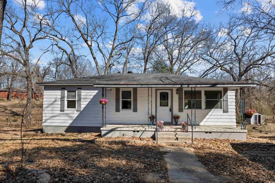 Space, updates, and over an acre to enjoy. This 5 bedroom, 2 bath home offers 2,258 square feet with a layout that truly works. Upstairs features 3 bedrooms and 1 bath along with an open living and kitchen area remodeled in 2017 with granite countertops, updated cabinetry, stainless appliances, and a large island made for gathering. One of the standout features of this home is the sunroom. Filled with natural light and overlooking the property, it makes the perfect second living space, playroom, home office, or peaceful spot to start and end your day. Downstairs includes 2 additional bedrooms and a full bath, offering flexibility for guests or multi-generational living. Some bedrooms feature original hardwood floors ready to be refinished and restored. Step outside to enjoy the covered front porch, a brand new deck built in 2025 with generous storage space underneath, a partially fenced yard for animals or gardening, and a 20x30 shop with electricity. A tankless hot water heater adds efficiency and convenience. Whether it’s coffee on the porch, relaxing in the sunroom, or evenings on the deck, this home offers space to live comfortably both inside and out.