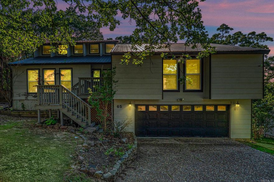 Discover the perfect blend of space and versatility at 65 Stoneledge, Maumelle! This charming home features 4 bedrooms and 3 full baths, with a unique bedroom off the garage—ideal for a man cave, gym, office, or guest suite. Bathed in natural light & contemporary design, this home offers the perfect blend of comfort & style. Spacious living area adorned with large windows that frame scenic views. Adjacent to the cozy updated kitchen, a sunroom provides the perfect spot to soak up the sunshine. Retreat to the luxurious primary suite, complete with a ensuite bathroom & plenty of closet space.   Outside, a huge deck awaits, perfect for entertaining or enjoying peaceful moments.  The proximity to the Maumelle community center ensures easy access to recreational amenities for the whole family to enjoy. For those who love to tinker or need extra storage, the walk-in crawl space includes a small workshop area.  This home offers both comfort and practicality, with plenty of room for everyone. With its modern design, abundant natural light, & convenient location, this home is the perfect combination of comfort and style for buyers seeking the ultimate Maumelle lifestyle. Schedule Today!