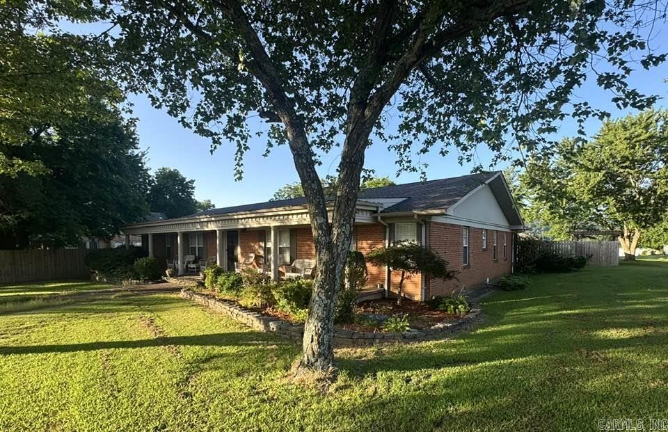 2 Homes side by side. Main Home Spacious Comfort & Outdoor Retreat,4-bedroom, 3-bath home features a flexible layout w/game room & bonus room, perfect for entertaining or a growing family. The oversized 3-car garage offers space for gym equipment & includes an inground storm shelter. Outdoors, enjoy a private fenced inground pool (new liner 2023), outdoor fireplace & mountain views across a spacious concrete patio. Indoors the home offers both wood-burning & gas fireplaces & CH&A. Recent updates include a new roof, remodeled bonus room & upgraded guest bath. Zoned for both residential/commercial use, home blends comfort & potential in one of Mountain Viewās most walkable locations. Second Home Classic Charm w/Modern Touch. Next door, home offers timeless appeal w/new roof, siding, & front windows. Sun porch at the back provides mountain views & a peaceful retreat. Home also includes a detached shop w/electricity, water, and 220V outletāperfect for a workshop/storage. A spacious rear parking area and mature trees add both function & curb appeal. Zoned for mixed use, this property suits everything from personal residence/short-term rental or small business! Steps from downtown area!