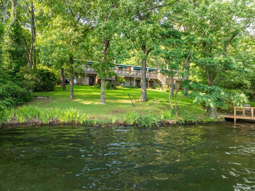 This stunning 2-bedroom, 1.5-bath condo nestled on the picturesque shores of Lake Hamilton offers a lifestyle of tranquility and luxury. Boasting breathtaking panoramic views, this hidden gem is part of an exclusive complex comprising just four units, ensuring unparalleled privacy and serenity. Embrace the beauty of nature with abundant green space, mature trees, and meticulously landscaped surroundings, creating a serene oasis right at your doorstep. Whether you're enjoying a morning coffee on the balcony or unwinding after a long day, the peaceful ambiance of this secluded enclave is unmatched. For water enthusiasts, the covered boat dock provides convenient access to Lake Hamilton, perfect for boating, fishing, or simply soaking in the scenic vistas. Indoors, the condo exudes modern elegance with updated kitchen and bathrooms, featuring sleek finishes and contemporary design elements. Practical upgrades including a new water heater and HVAC units offer peace of mind and ensure comfort year-round. Whether you're seeking a weekend retreat or a permanent residence, this exceptional property offers a rare opportunity to embrace lakeside living at its finest.