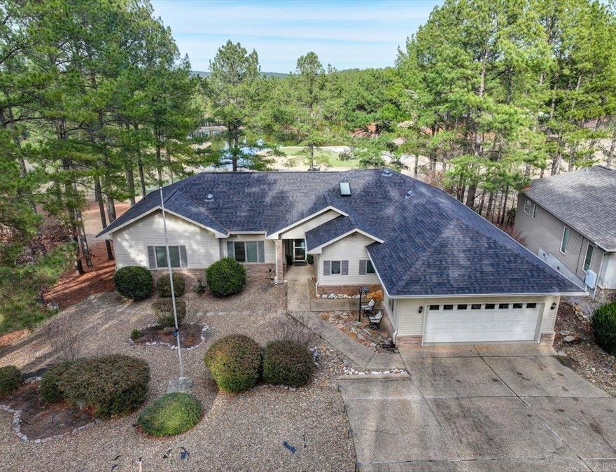 Golf Course Living with Lake Views | Granada Golf Course, Hot Springs Village  Welcome to 432 Maderas Drive, ideally positioned on the 11th hole of the Granada Golf Course in Hot Springs Village, offering sweeping fairway views with the lake beyond. Expansive windows throughout the home flood the space with natural light and frame the scenery from the moment you enter.  The open-concept kitchen and living area is designed for both everyday living and entertaining, with views that remain the focal point. An enclosed Arkansas room provides flexible, year-round space to relax and enjoy the changing seasons overlooking the course.  This thoughtfully designed home includes an extra-large second en suite, ideal for guests or multi-generational living. The layout maximizes light, comfort, and functionality while embracing its exceptional setting.  Located in the largest gated community in the country, residents of Hot Springs Village enjoy nine championship golf courses, multiple lakes and marinas, miles of hiking and biking trails, fitness centers, pickleball and tennis courts, and a vibrant lifestyle surrounded by the Ouachita Mountains.