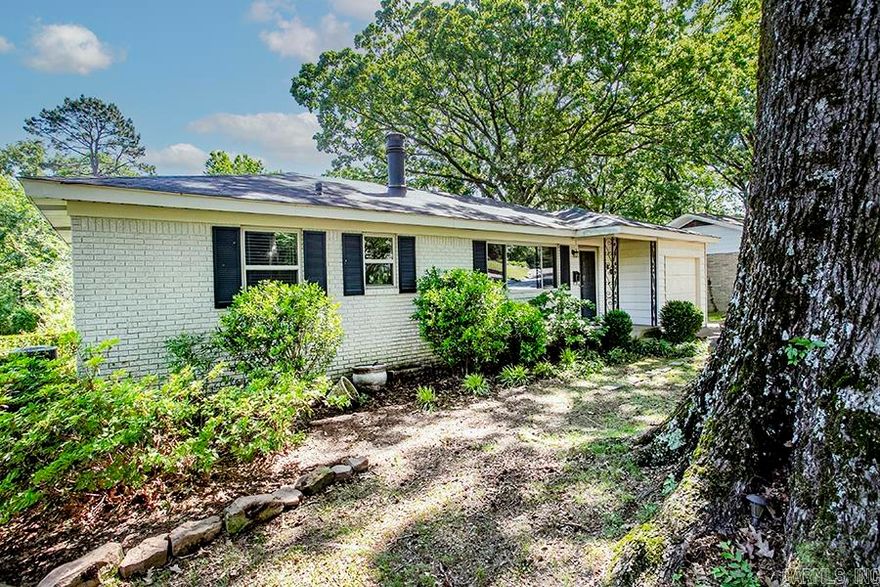 Nestled in the heart of historic Park Hill, this gorgeous all-brick 3 bedroom , 1 bath home is full of charm and character, and a true park like setting.  Beautifully updated with a remodeled bathroom, gleaming hardwood floors, fresh paint throughout, this home has been lovingly cared for and is move- in ready.  Situated on approximately a one third acre lot, the beautifully landscaped yard with mature trees creates a peaceful, park-like retreat perfect for relaxing or entertaining. Enjoy the beauty and privacy of this incredible outdoor space right in the city. Homes with this much charm, land and setting in Park Hill are rare. A must-see that will not last long!