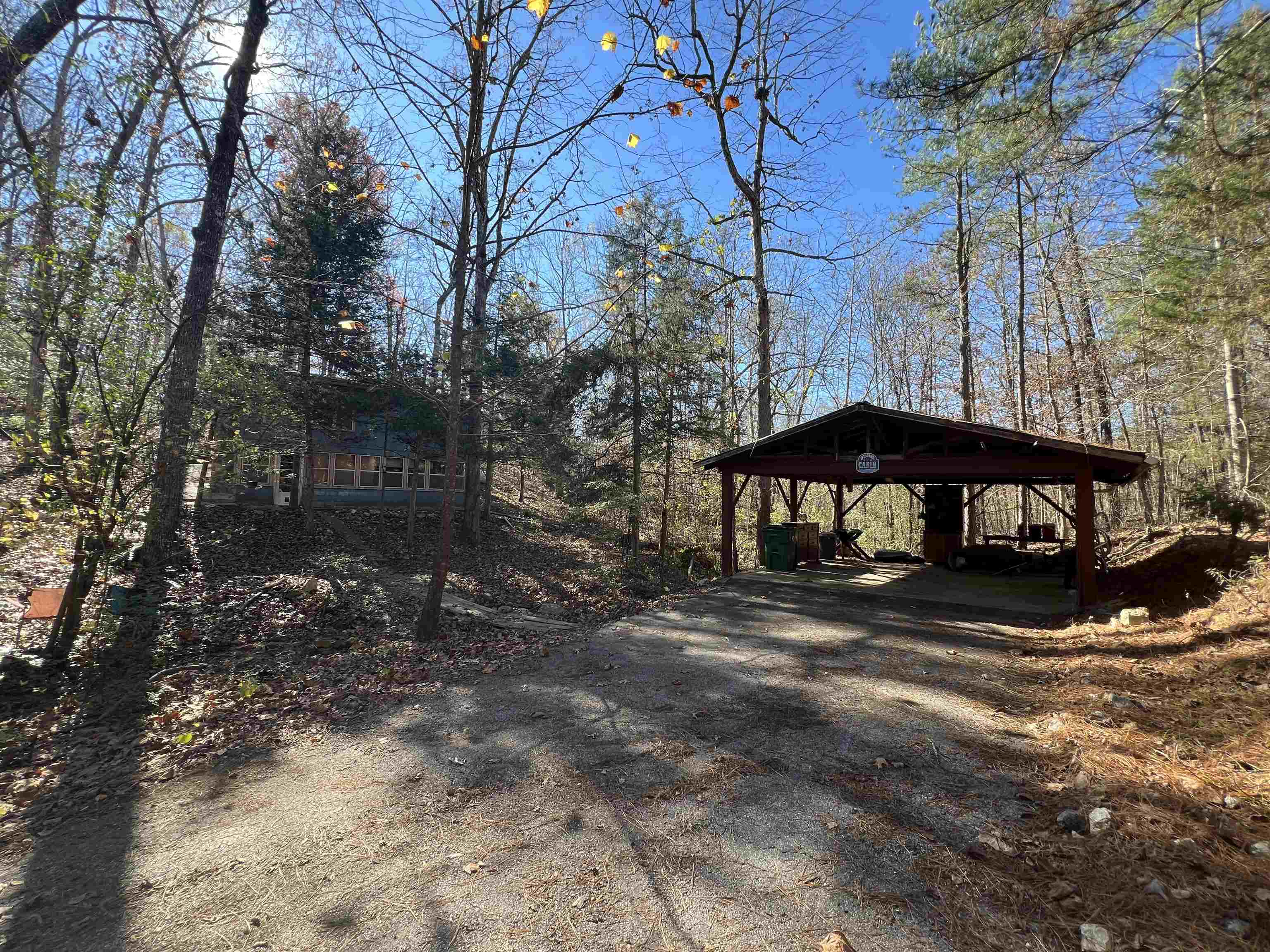 Welcome to your private haven in Highland! This delightful 2-bedroom, 1-bathroom home sits on 1.5+/- acres across eight spacious lots, providing a rare combination of space and seclusion. Thoughtfully updated with a new roof and electrical system in 2022, this home is move-in ready. Sit by the fireplace during those winter nights while watching the snow fall through the large picturesque window. The heated and cooled basement adds versatility to the living space, while the gated driveway and two-car covered carport ensure both privacy and convenience. A picturesque wet-weather creek meanders in front of the home during rain, adding to the tranquil ambiance. Ideally located near Lake Mirandy for fishing and outdoor fun, with a children’s park nearby, this property is perfect for those seeking a peaceful retreat with easy access to modern conveniences.