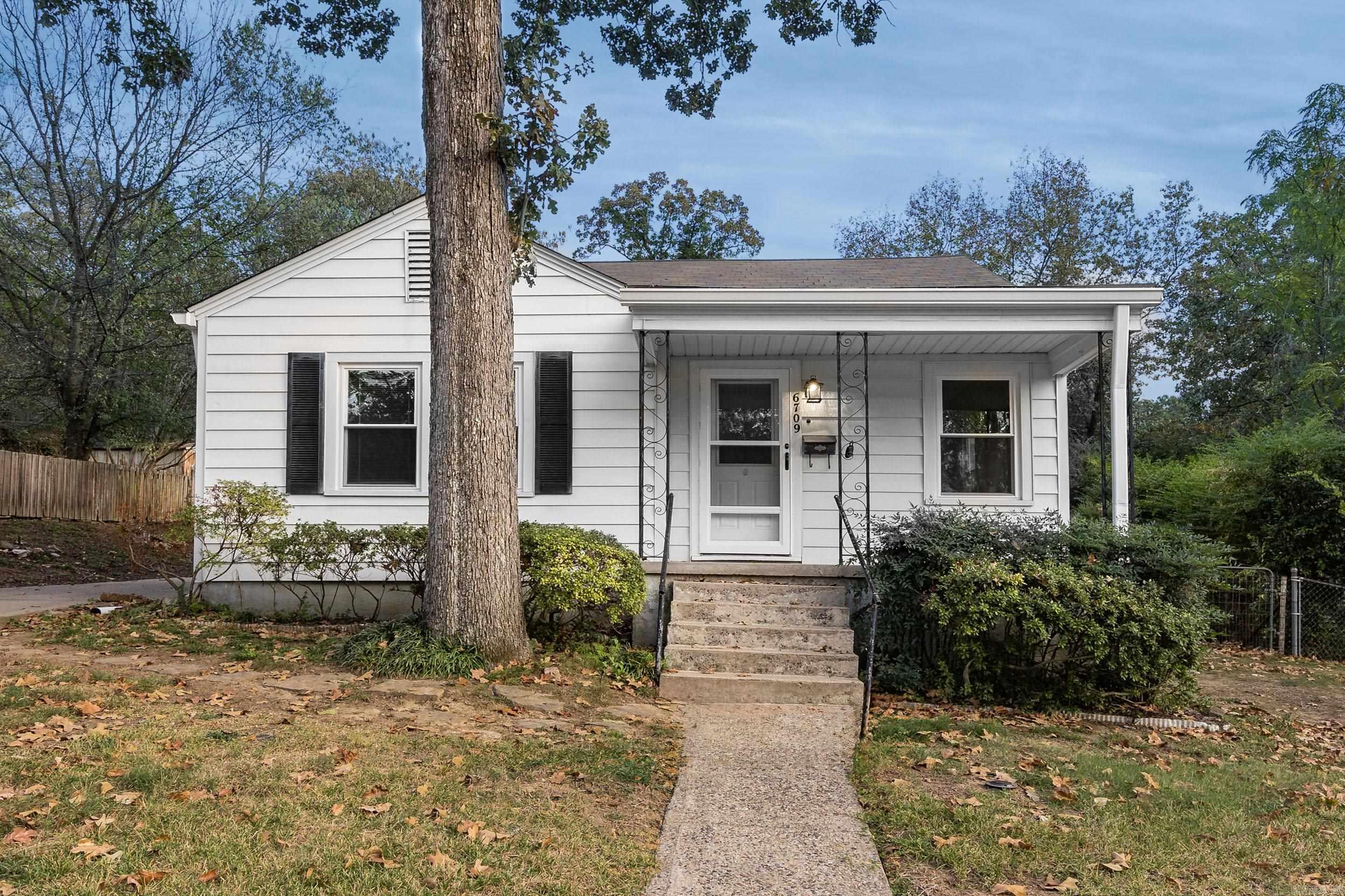 6709 Beacon is a well cared for home located in a highly sought after neighborhood. This freshly painted 1940's home features 2 bedrooms, 1.5 baths, and an office or potential 3rd bedroom. Inside, you'll find a living room and den, both with beautiful hardwood floors. The kitchen, den, and wet areas have new LVT flooring, and there's a new dishwasher in the kitchen. The home also comes with a refrigerator, washer, and dryer. The 1 car detached garage is perfect for parking, extra storage, or a shop. Other notable features include new kitchen cabinets and hardware, walk-in closets, newer windows, roof, and HVAC. Outside, there's a covered front porch and a patio. This home is ready for a new owner to move right in. ***Seller giving $7,000.00 Buyer Concession towards closing costs or to buy down rate!!!