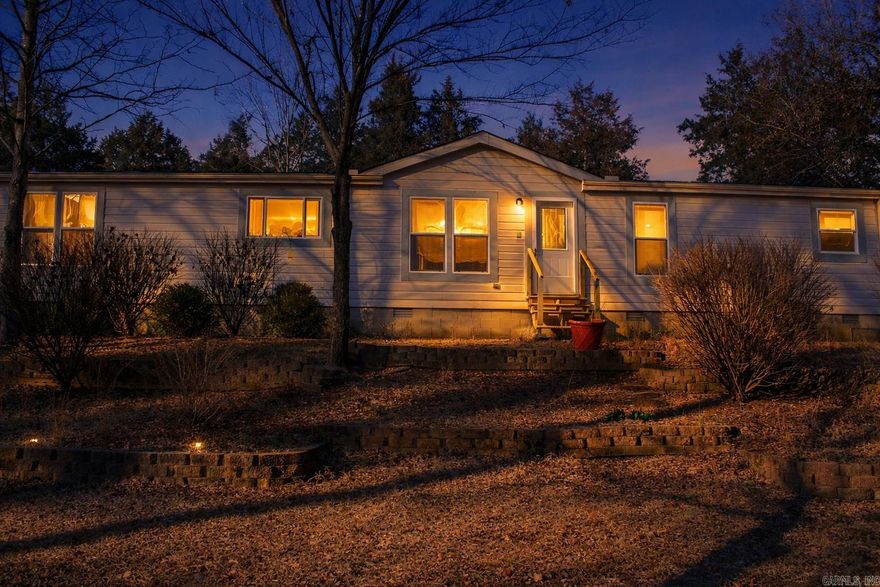 If you're searching for a charming home on some land minutes from Searcy, your search ends here. This property perfectly blends comfort and convenience, ideal for those who value space and town proximity. The large master bedroom offers ultimate relaxation, with an impressive closet and bathroom. The living room flows into a spacious kitchen with a functional island. Updated flooring in the kitchen and bathroom and a new roof in 2022 ensure the home is move-in ready. A large back deck offers picturesque views, ideal for outdoor entertaining. This home has everything you need, so why wait? Let's explore it today!