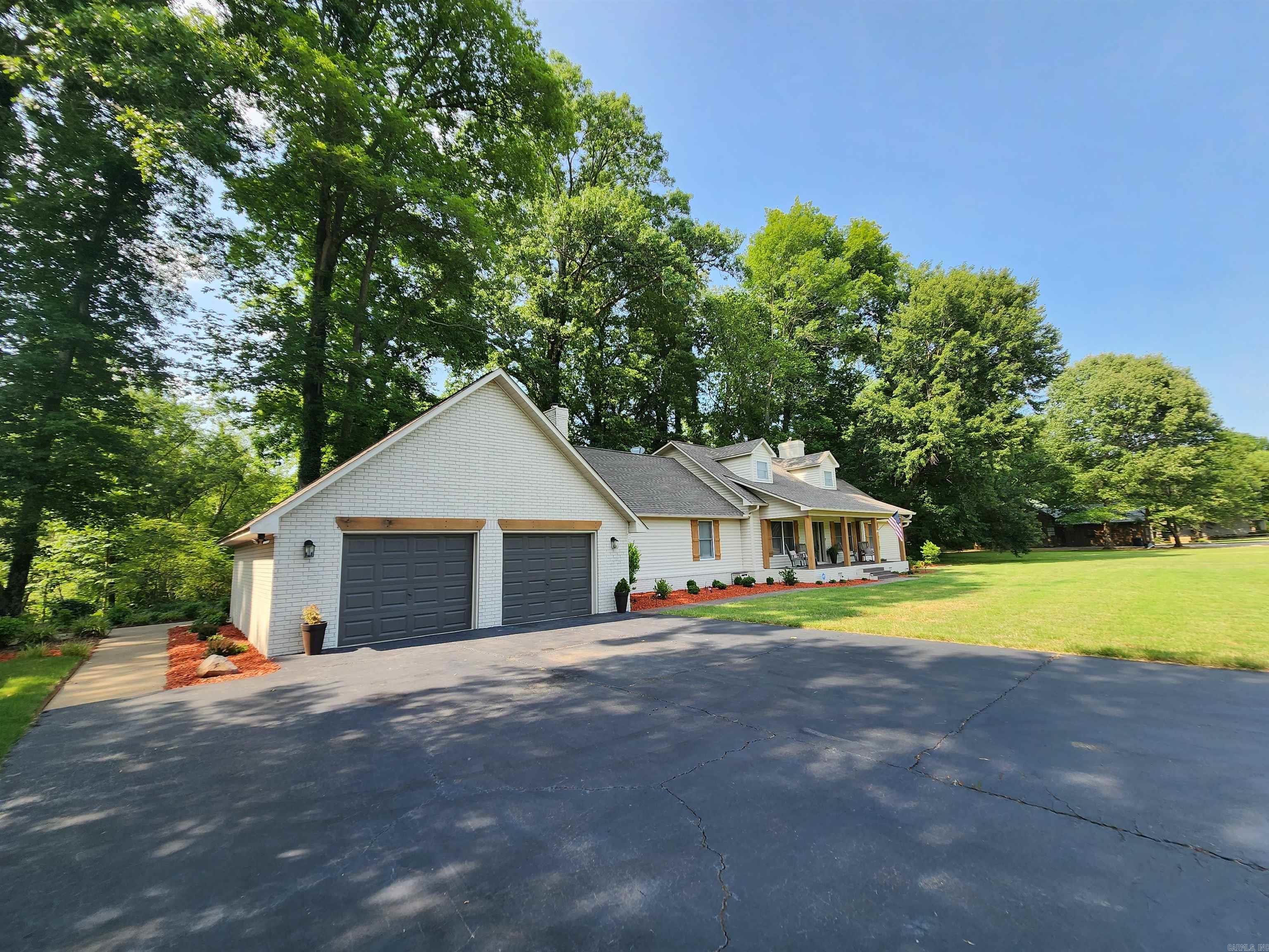 Fully Furnished & Remodeled Home by Josh and Brandy Hurd of Hurd Construction sitting on the shores of the famous trout fishing river, The Little Red River! This  Elegant Home offers 4 different walk out doors to am expansive deck, leading down to the floating dock below, the Dock has even been upgraded with new floatation, ramp and lighting! Inside you find that nearly every corner has been updated & remodeled. 3 gas log fireplaces, 2 extra bunk rooms not counted as bedrooms, X-tra Large Entertaining/ family room, Custom built table using reclaimed wood from a 100 year old cotton gin properly named Southern Cotton Dinning Table & a 2nd custom table built also from reclaimed wood from an old smoke house, properly named, Anglers Breakfast Table! like the rest of this home these dinning areas are finely decorated with only the finest items & décor. In the Kitchen find another beautiful view of the river, stainless appliances all by whirlpool & a ice machine offering the small ice we all love! Under Cabinet lighting, vent a hood & box built from reclaimed wood, accent beams, and more custom pieces throughout this home! Drip system for landscaping & beautiful stone paths & much more!
