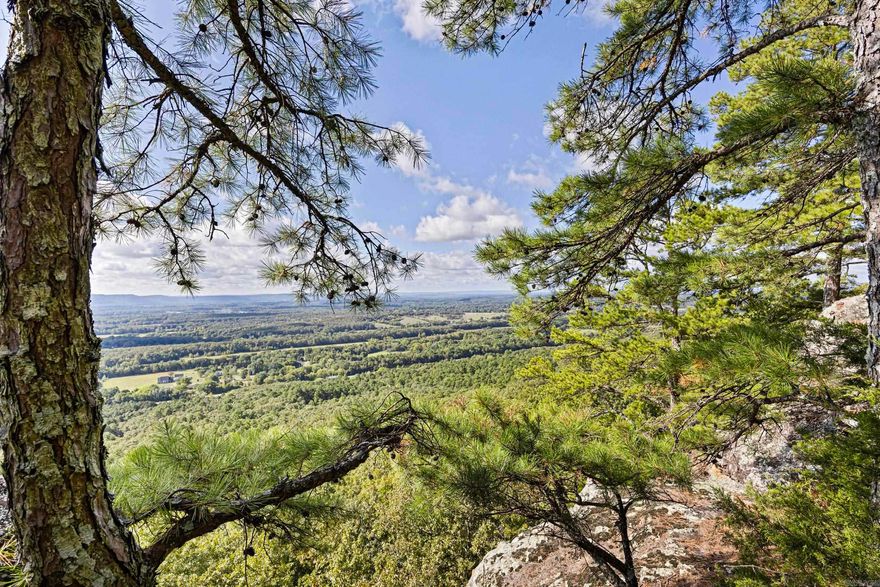 Acreage with a Million-Dollar View! Tucked away along a quiet, secluded road off Crow Mountain, this rare bluff-view property offers a serene escape from the bustle of everyday life. Situated amongst beautifully maintained homes, this 2.2-acre parcel boasts BREATHTAKING views, mature trees, and gently sloping land—making it the IDEAL location for those seeking privacy and serenity. Whether you're building a dream home or retreat, the panoramic vistas provide the perfect backdrop for a life of peaceful seclusion. Don't miss out—this property won't last long!