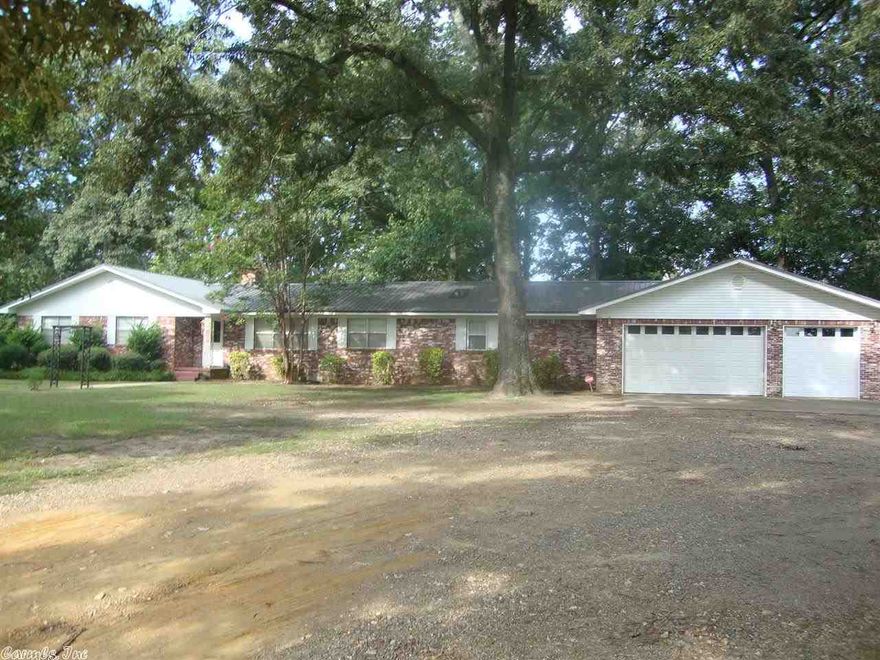 AWESOME SETTING WITH OVER 4 ACRES THAT BACKS UP TO WOODS!... THIS HOME HAS 5 BEDROOMS OR ONE OF THEM COULD BE AN OFFICE! OPEN FLOOR PLAN WITH A BREAKFAST BAR IN KITCHEN ALONG WITH A WORK STATION...NEW UPDATES IN THE PAST TWO YEARS INCLUDE A NEW METAL ROOF, OVEN,DISPOSAL AND A NEW ELECTRICAL BOARD FOR THE HEAT AND AIR UNIT...THIS HOUSE ALSO HAS WHAT EVERYONE IS LOOKING FOR....PLENTY OF STORAGE...SOME  OF THE BEDROOMS HAVE TWO CLOSETS!!