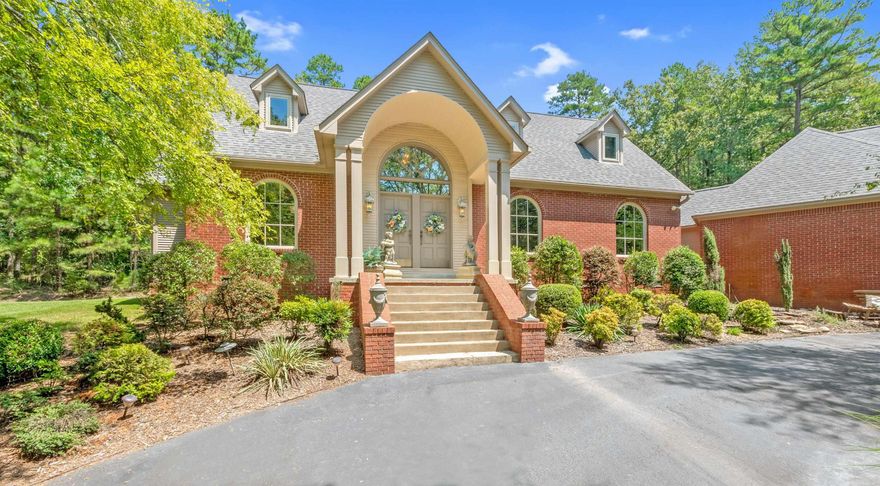 Private Estate Living at 7107 Ferndale Cut Off - A Tranquil Country Oasis Just Minutes from the City of Little Rock!  Take the gated driveway up to this stunning country estate and prepare to be captivated.  A circular drive welcomes you with a serene pond, featuring cascading waterfalls over natural rock - grand first impression that sets the tone for the rest  of this tranquil retreat.  Situated on over 3 wooded acres, this property offers unmatched privacy and outdoor beauty.  Just steps from you back door, you'll find a resort-style, landscape pool with a second waterfall feature.  The main home offers 4 spacious bedrooms and 3.5 bathrooms, including a primary suite on the main level with a luxurious jetted tub and a beautifully appointed bathroom.  Additional features include: Formal Dining, Sunny eat-in kitchen, Spacious living room for gathering or just relazing, dedicated office/nursery space, large game room. laundry room with sink, 4-car attached carport.  Behind the home sits a massive 2,000 sq. ft. metal shop with ample room for all your hobbies, tools, toys and storage needs.  Whether you're a car enthusiast, craftsman, or just need space, this buildidng delivers.