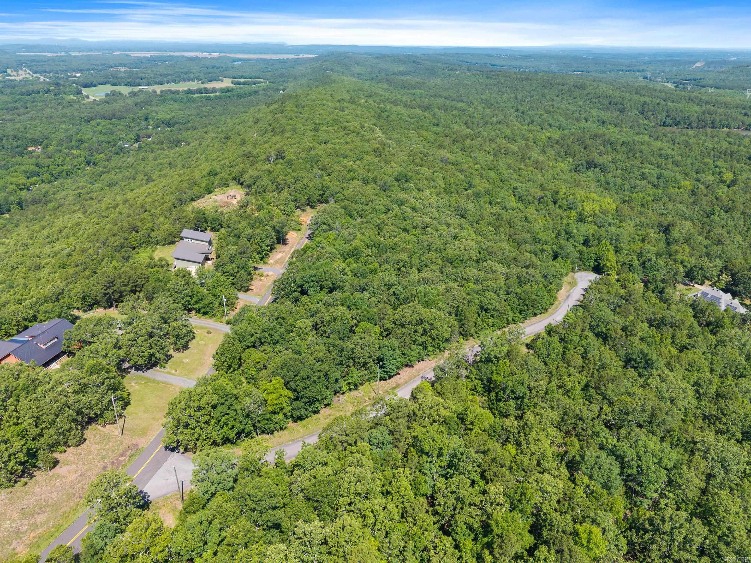 Two beautiful lots in High Point Subdivision located in the Arkansas River Valley, just four miles northwest of Mayflower and less than 10 minutes from the nearest on-ramp to I-40. The subdivision is private and tucked away on a dead-end county road. The lots together are 6.01 acres. The land is very buildable with a slow downward slope from the road. These tracts have lots of oak and hickory trees as well as few winged elms, Deerberry shrubs, muscadine vines, and wild blackberries. It’s common to see abundant wildlife, including white-tailed deer, rabbits, gray squirrels and many species of birds. There are several very nice homes along the ridge, with residents whom all have the self-sufficiency of their own water wells. Minimum building square footage is 1,450 and no mobile homes are allowed. More lots are available.