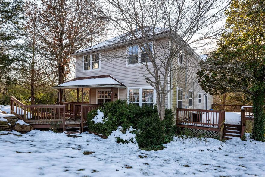 Situated on 6.93 acres with Little Greenbrier Creek on the property, this 5-bedroom, 3-bathroom fixer upper home offers plenty of space and potential. With clearing of foliage, replacing decks and other renovation, the back of the house could offer you a private oasis with a beautiful view of the ravine and creek area.  A 1,000~ SF shop provides additional storage and workspace.  Property sold As-Is, Where-Is. Cash or Conventional Financing. ***Agents See Remarks Before Showing***