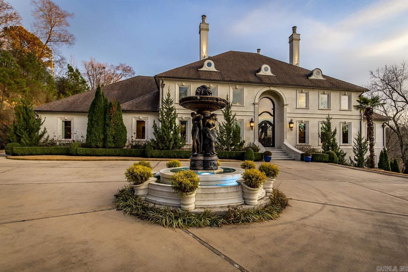 Lakefront Masterpiece! This gorgeous custom-built home sits on 5.5 stunning acres. This 4-story estate has it all!! Gated entrance, 2 private boat docks, salt-water pool, grotto, waterfall, outdoor kitchen, veranda, indoor basketball court, theater, sauna, safe room, arcade, tanning room, massage room, gym, wine cellar, library, and elevator. Each of the stately 5 bedrooms has an ensuite for a total of 6 full-baths and 2 half bathrooms. The Chef's kitchen is equipped with state of the art appliances and features. Multiple security features throughout the home. Come see this one of a kind BEAUTY!