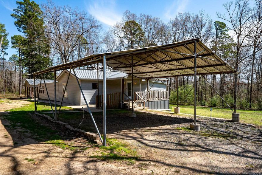 Awesome custom built, all electric home on 4 acres in the country, but extremely convenient to shopping and the interstate. Open floorplan main living area. All new kitchen appliances. Beautiful wood trim, Cabinets, kitchen island, and built-ins. Massive primary bedroom with walk-out screened porch.  Large, detached shop/studio/mancave/she-shed/storage. Newer package HVAC and metal roof (2015). You'll love rocking on the front porch listening to the whippoorwills.  Just add chickens and your garden.....