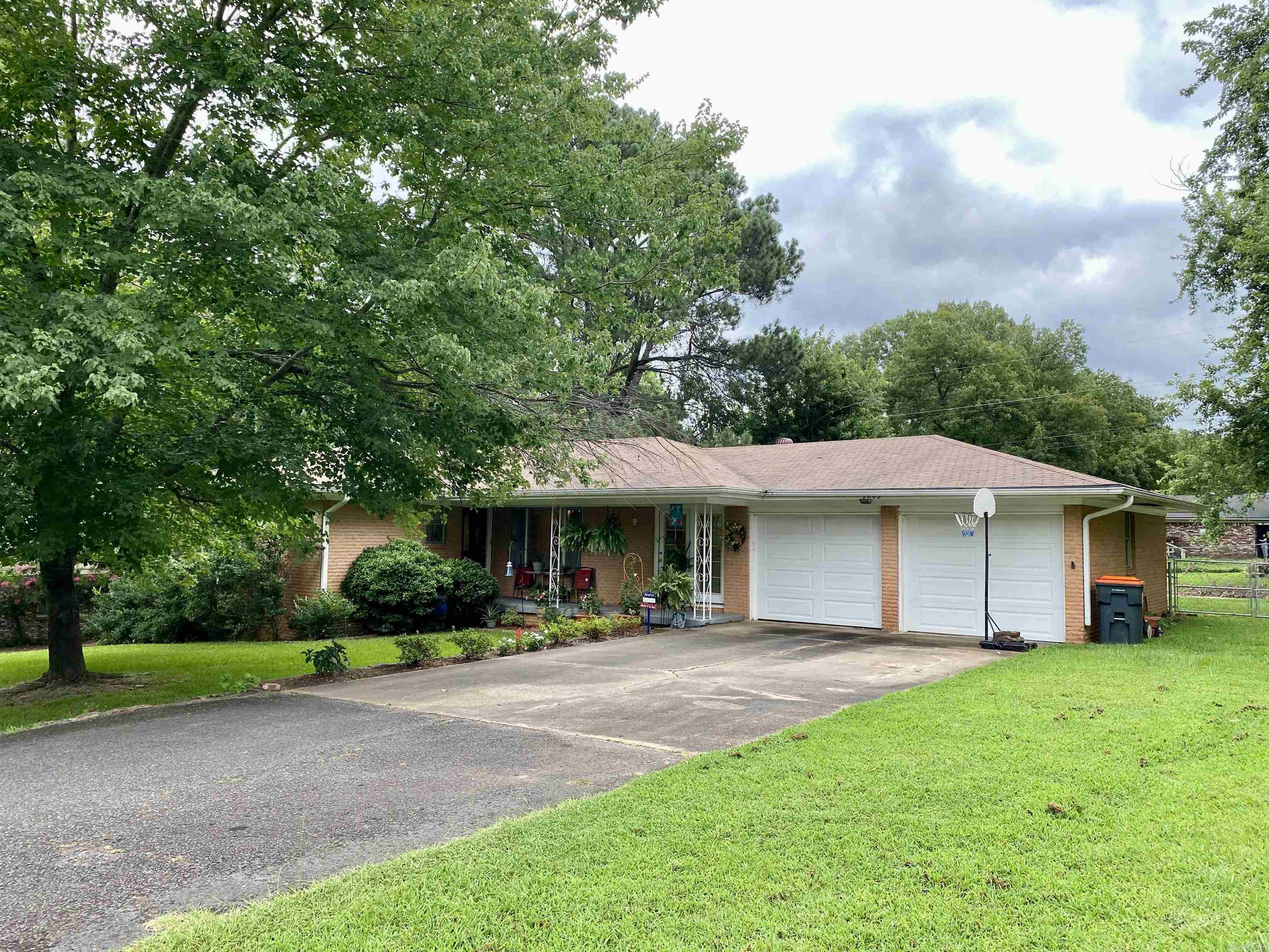 Warm and inviting with a true sense of home, this well-kept property sits on a beautifully maintained, lush lawn accented by established landscaping and mature shade trees. The fully fenced yard offers valuable outdoor living space, including a relaxing sunroom perfect for year-round enjoyment adding an additional 228 feet of living space. A welcoming front covered porch invites you inside, the semi-open living, dining, and kitchen areas creating an ideal space for gathering. The spacious kitchen features walls of cabinetry, a breakfast bar, and a gas rangeāperfect for home cooking. An attached laundry area adds convenience and additional storage. The private primary suite includes a makeup vanity and a full en-suite bath. For added peace of mind, this home comes with a current termite policy and a one-year home warranty