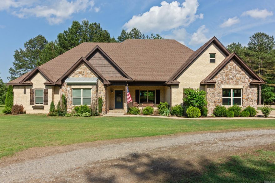 Welcome to your dream home with your own private access to Bald Knob Lake! This custom-built home features an open floor plan, creating a seamless flow throughout. The gourmet kitchen is a chef's delight, with high-end appliances and ample space for cooking and entertaining. The home has 5 bedrooms, and a large theater room. The theater room could easily be used as a 6th bedroom. Have family fun in the ultimate man cave, perfect for relaxing or hosting game nights.  Enjoy the wildlife and lake access from your backyard and unwind on the spacious concrete patio, perfect for family gatherings and entertaining. Situated on over 2 acres, this property offers plenty of privacy and room to roam. Don't miss this opportunity to own a one-of-a-kind home in this picturesque setting!